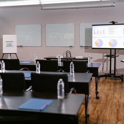 Bottle of water and a timer on a wooden floor